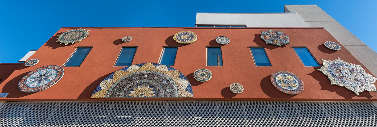 Exterior of Legal Aid Foundation of Los Angeles' new headquarters on 8th Street and Union. Piece by Piece installed a series of 13 mandalas.